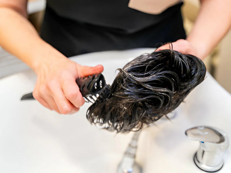 Gently detangle the wig with a wide-tooth comb to prevent breakage