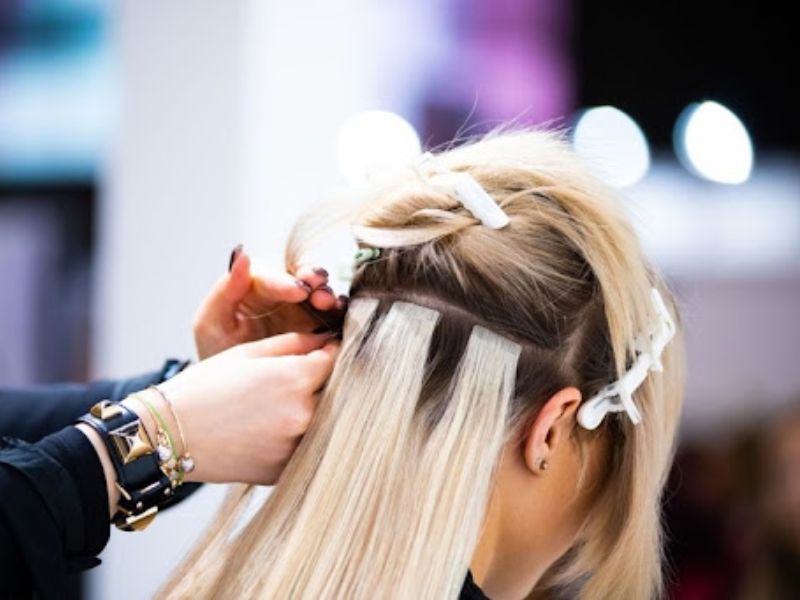 The application of tape-in hair extensions