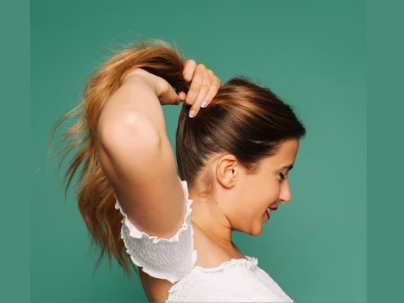Tie your hair extensions into a high ponytail