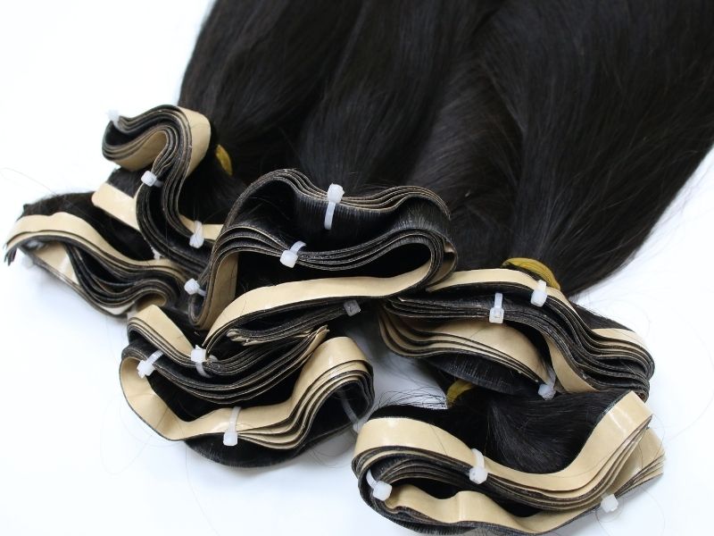 Premium tape in hair extensions of Apohair