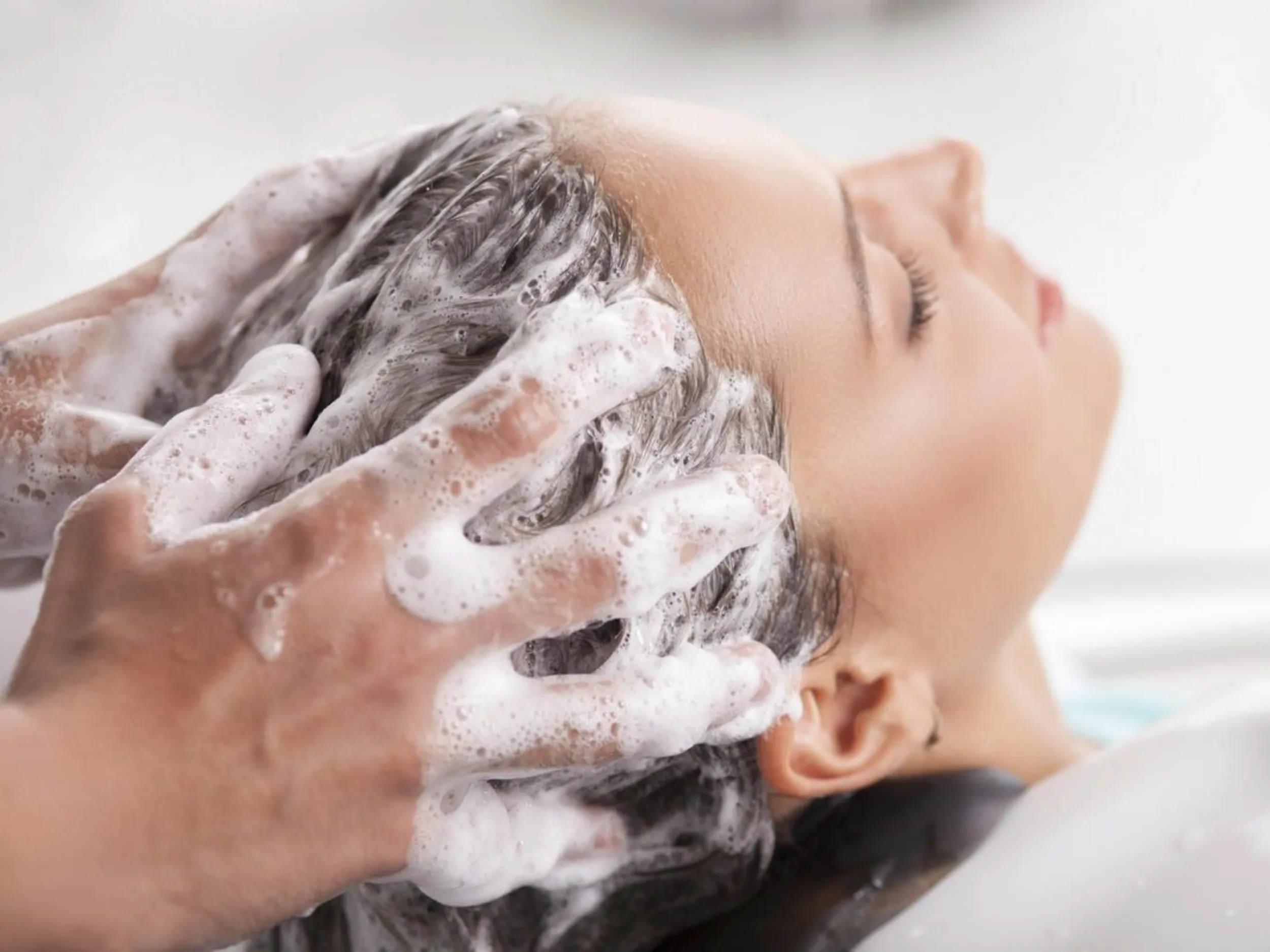 Cleanse and condition hair to ensure even bleach penetration and protect strands from oxidation damage