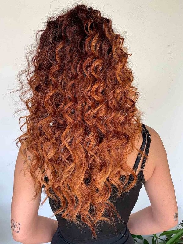 Ombre coloring is a fantastic way to enhance curly hair