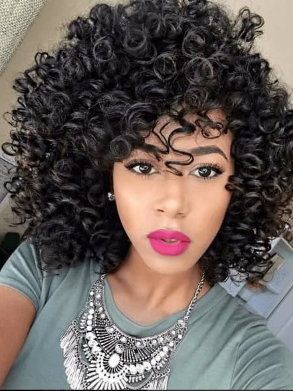 This sexy, curly long hair is an effective style for managing very thick hair