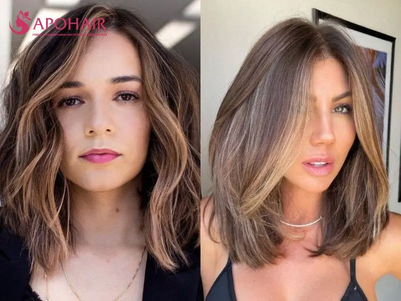 Two soft layered lobs with face-framing pieces curving inward toward the collarbone