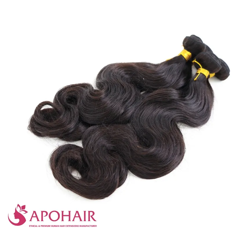 Natural black body wave human hair bundles on white background at Apohair