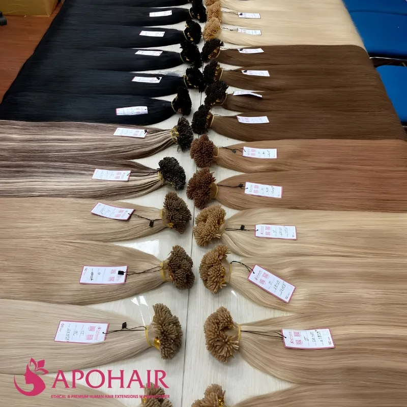 Large inventory of wholesale straight I-tip keratin hair extensions in various colors at Apohair factory