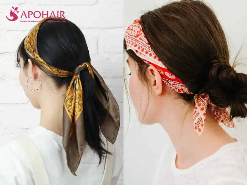 Two women wearing patterned scarves tied around the head and beneath the hair