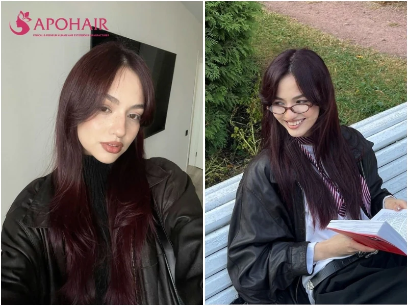 Two women with near-black hair carrying a dark red-violet cherry tint, one with curtain bangs, on cool skin tones