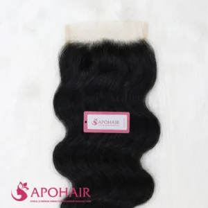 Close-up of a black body wavy closure 5x5 showing the lace base, the parting area and wide S-shaped waves