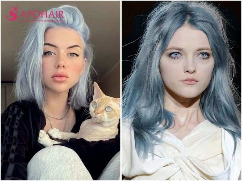 Two women with icy blue hair, one in a pale blue bob holding a cat and one in long blue-gray waves, on cool skin tones